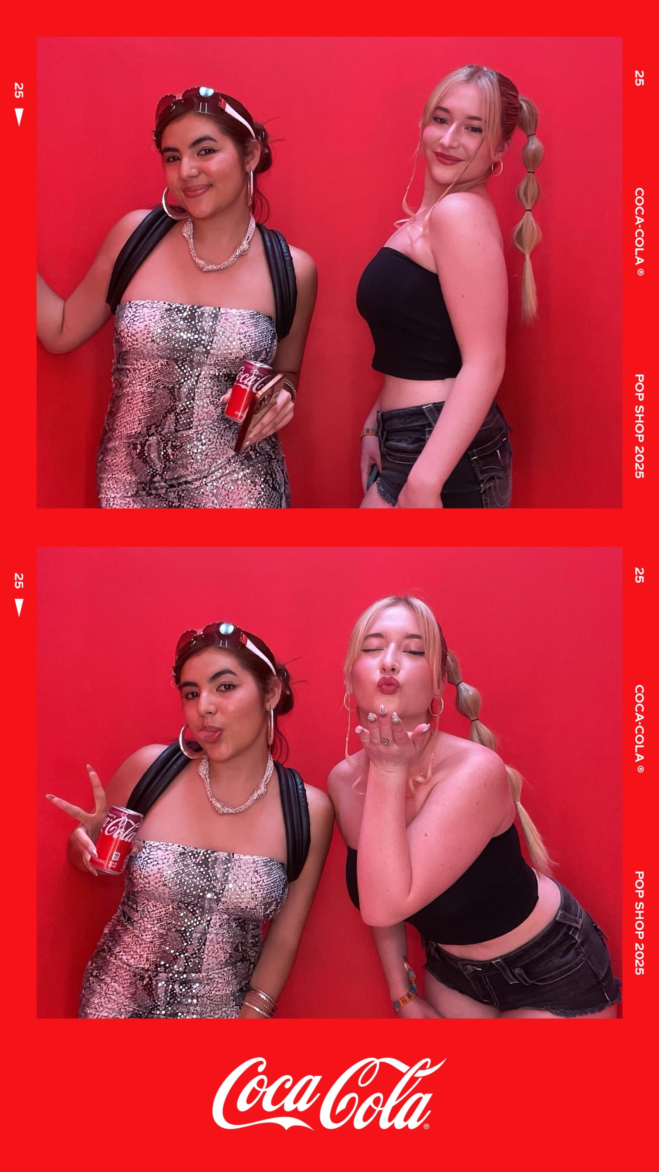 Two guests in silver sparkle and black styling pose in the red booth.